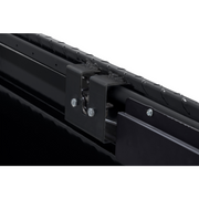 Close-up of the under-rail mounting clamp and hardware that secures the Weather Guard 127-52-04 crossover box to the bed rail without drilling
