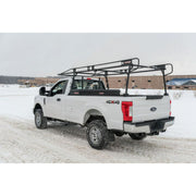 Weather Guard full-size steel truck rack and crossover box on a white Ford Super Duty parked at a snowy jobsite