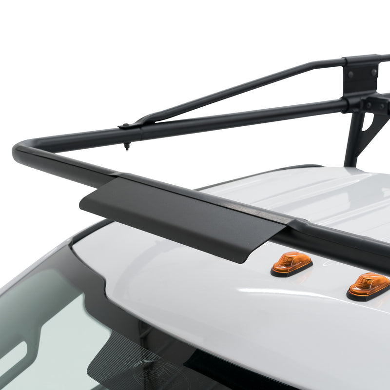 Close-up of the over-cab airfoil on the Weather Guard 1275 steel truck rack above a white pickup roof