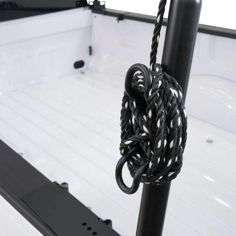 Rope coiled around a tie-down hoop on the upright of the Weather Guard 1275 steel truck rack