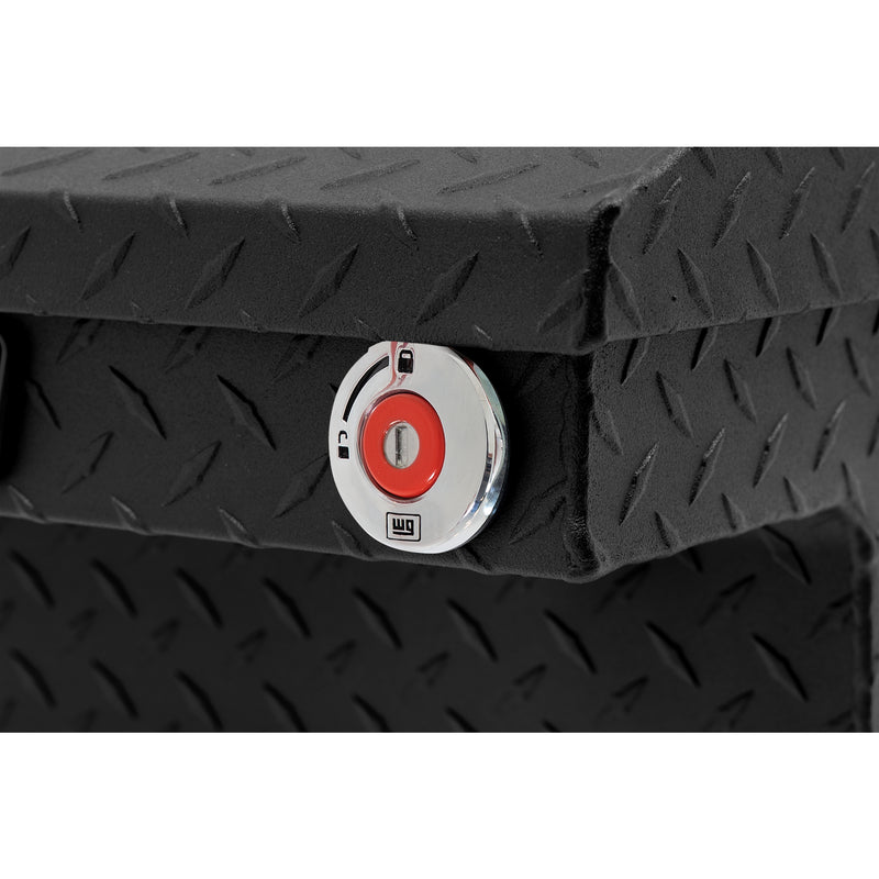 Weather Guard 131-52-04 crossover saddle box in textured matte black, close-up of the red push-button lock and Weather Guard badge