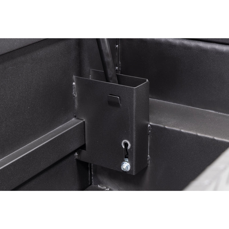 Weather Guard 131-52-04 crossover saddle box in textured matte black, close-up of the welded gas strut shield inside the body