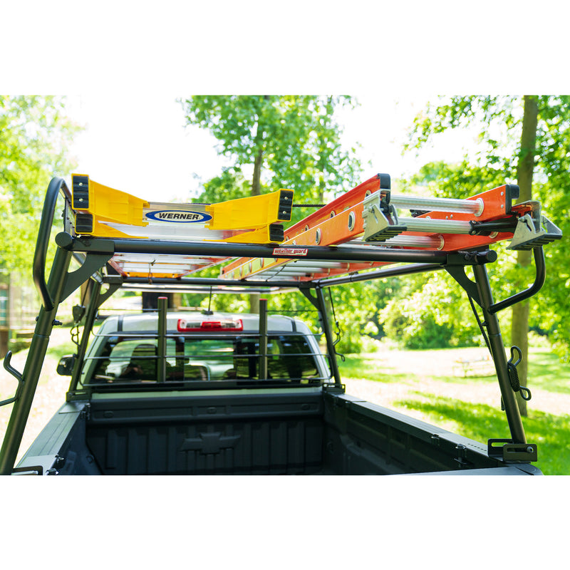 View into the bed of a pickup with ladders on the Weather Guard compact truck rack and a cab protector fitted