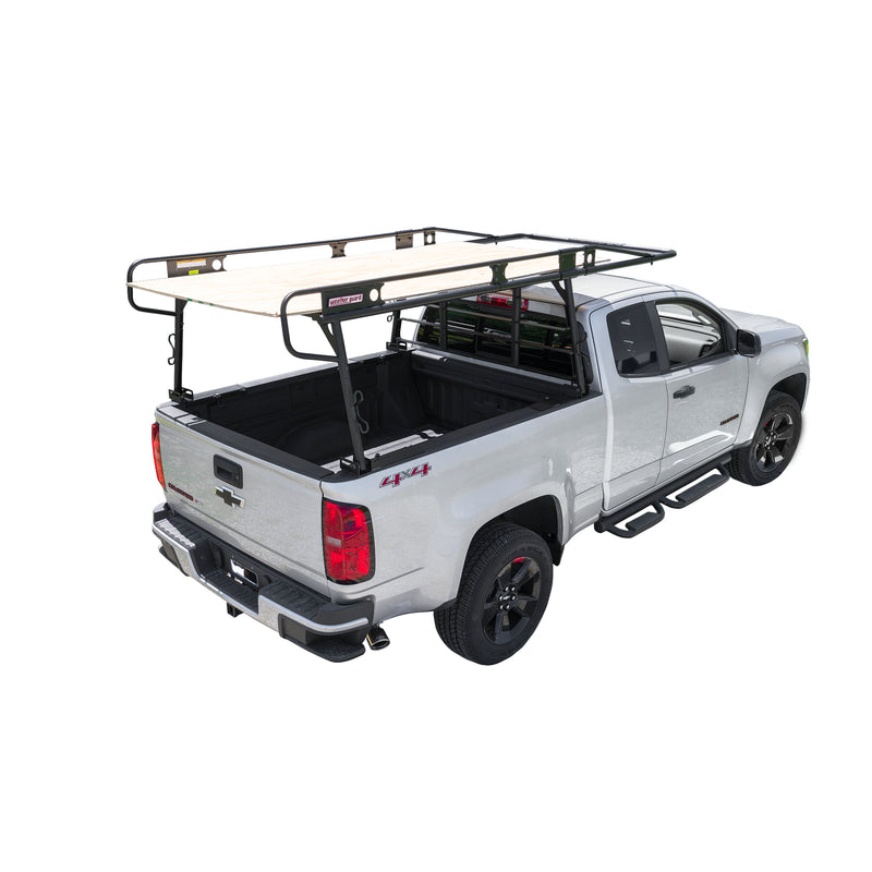 Sheet of plywood carried flat on the Weather Guard compact truck rack of a white pickup