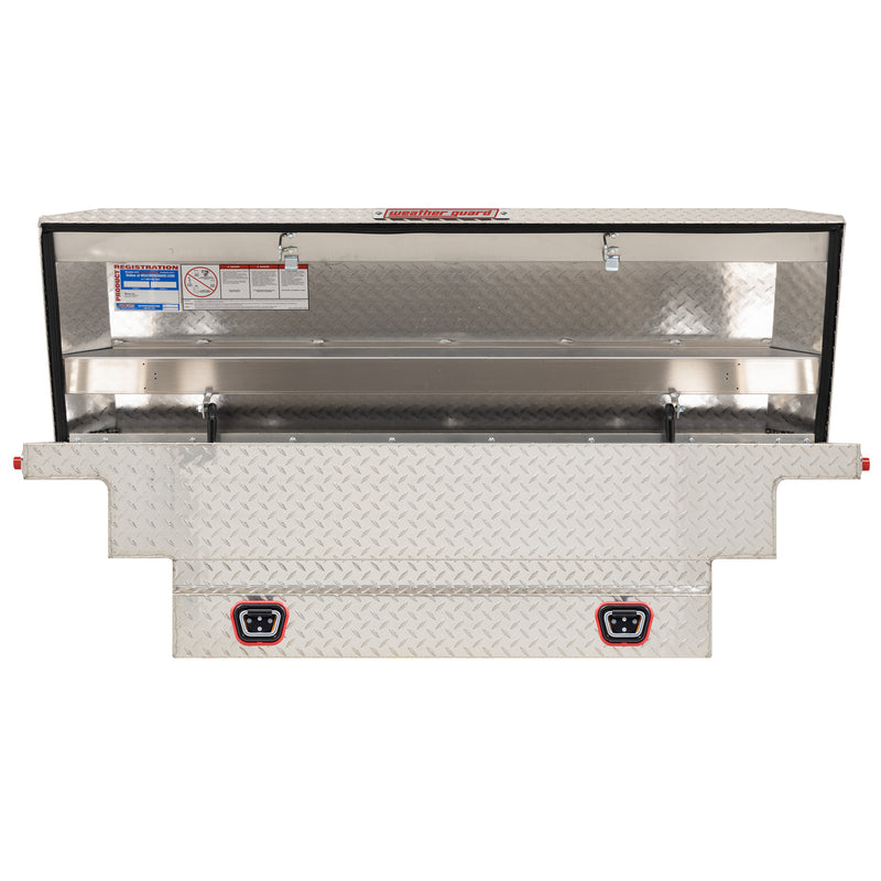 Weather Guard 137-0-04 crossover saddle box in bright aluminum diamond plate, straight-on front view with the lid open, showing the full interior
