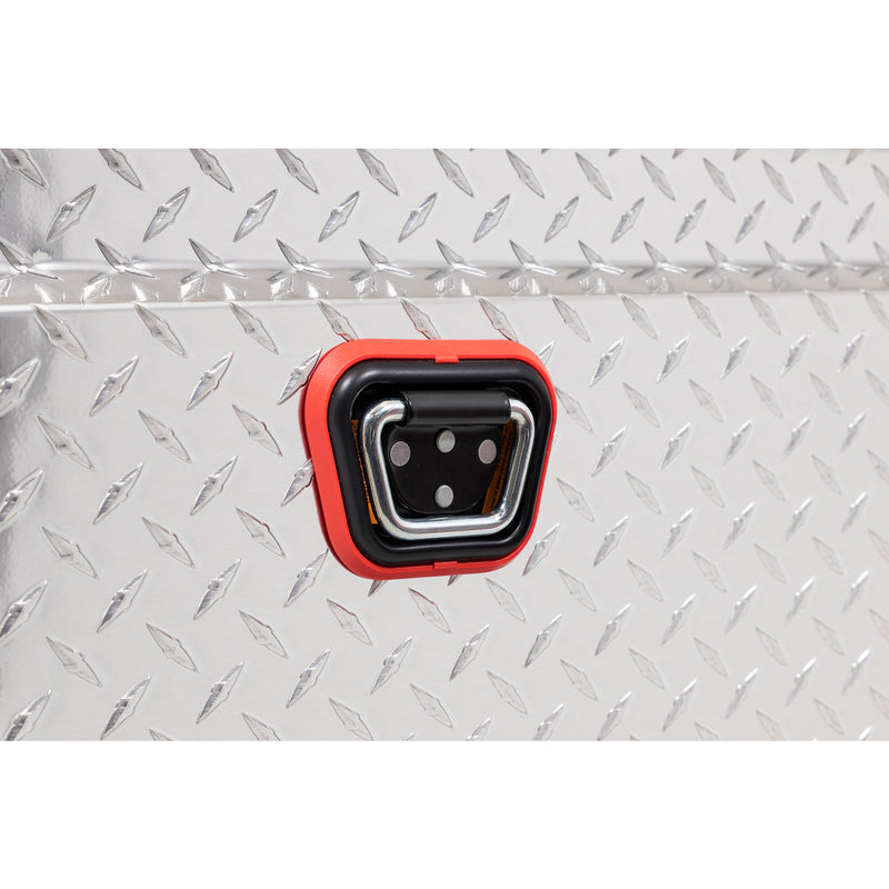 Weather Guard 137-0-04 crossover saddle box in bright aluminum diamond plate, close-up of the reinforced tie-down buckle on the body