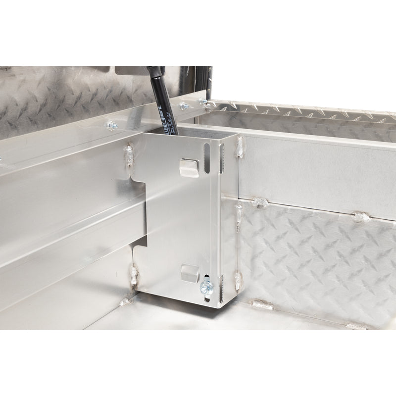 Weather Guard 137-0-04 crossover saddle box in bright aluminum diamond plate, close-up of the welded gas strut shield inside the body
