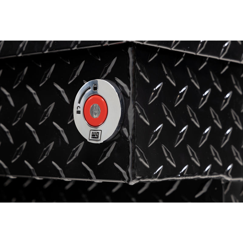 Weather Guard 137-5-04 crossover saddle box in gloss black, close-up of the red push-button lock and Weather Guard badge