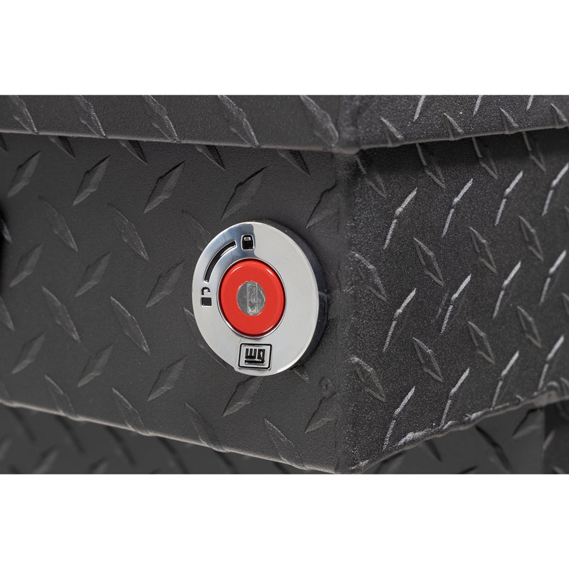 Weather Guard 137-52-04 crossover saddle box in textured matte black, close-up of the red push-button lock and Weather Guard badge