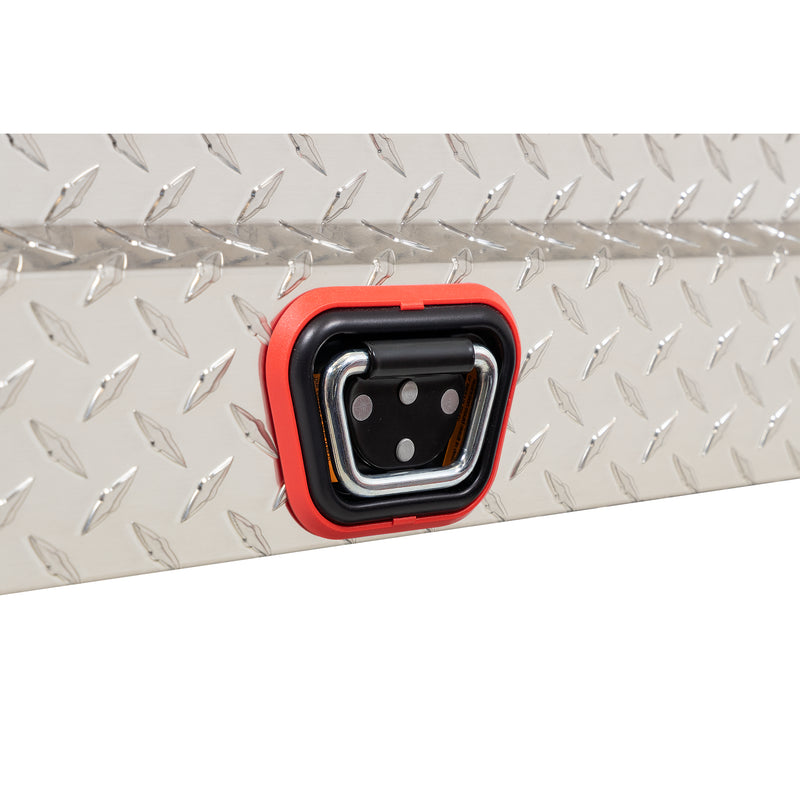 Weather Guard 154-0-04 crossover saddle box in bright aluminum diamond plate, close-up of the reinforced tie-down buckle on the body