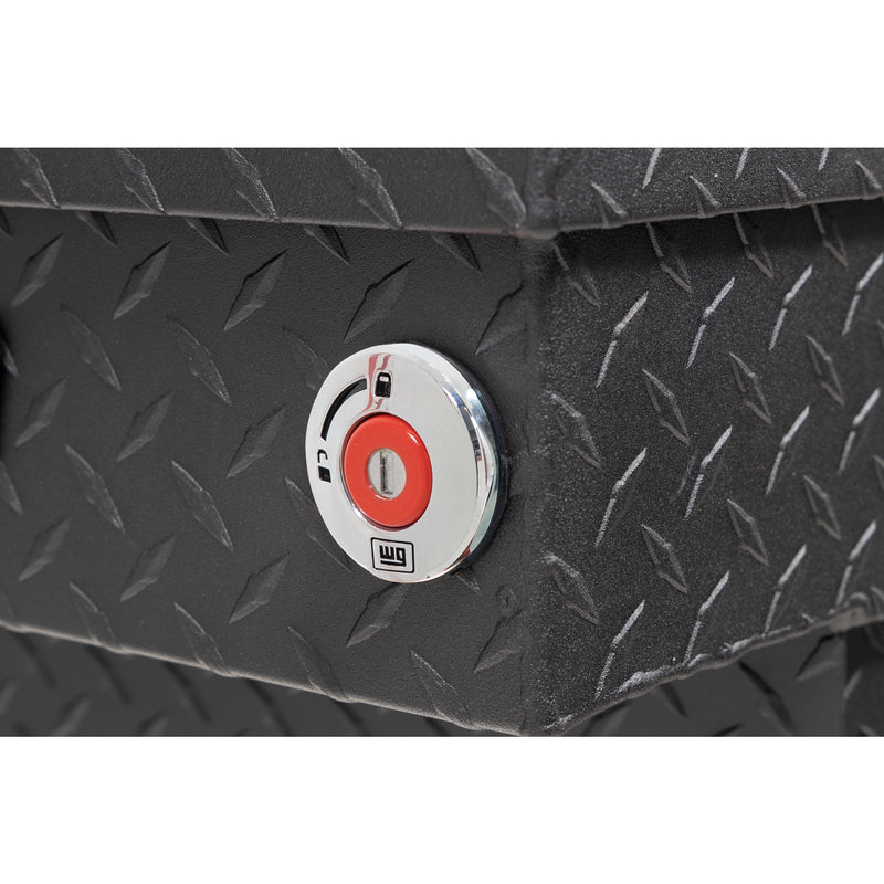 Weather Guard 154-52-04 crossover saddle box in textured matte black, close-up of the red push-button lock and Weather Guard badge