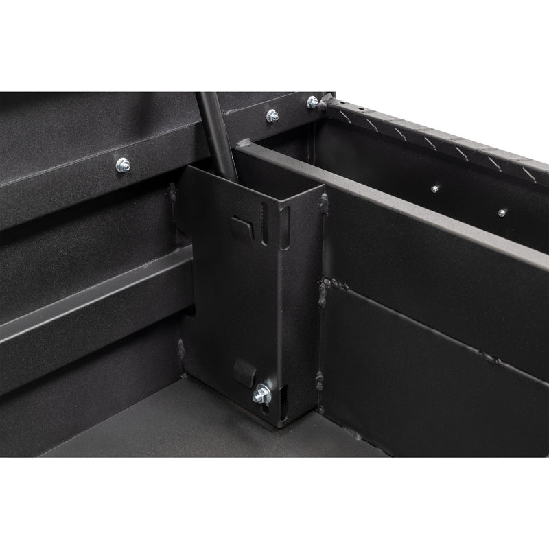 Weather Guard 154-52-04 crossover saddle box in textured matte black, close-up of the welded gas strut shield inside the body