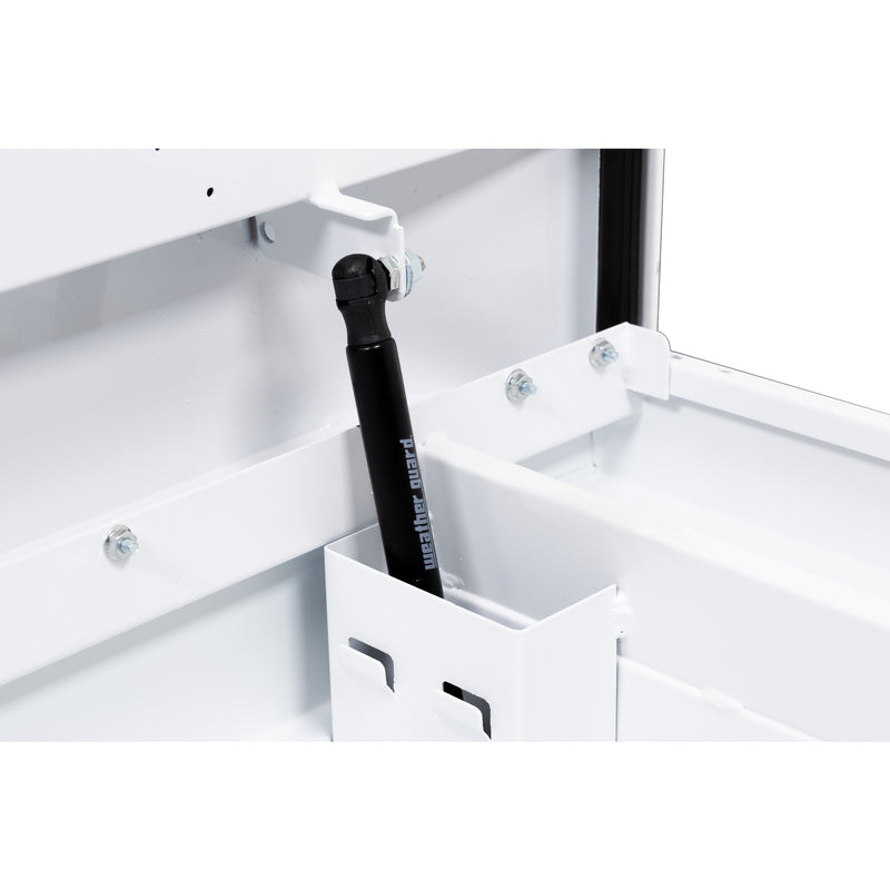 Weather Guard 156-3-04 crossover saddle box in brite white, close-up of the gas strut holding the lid open