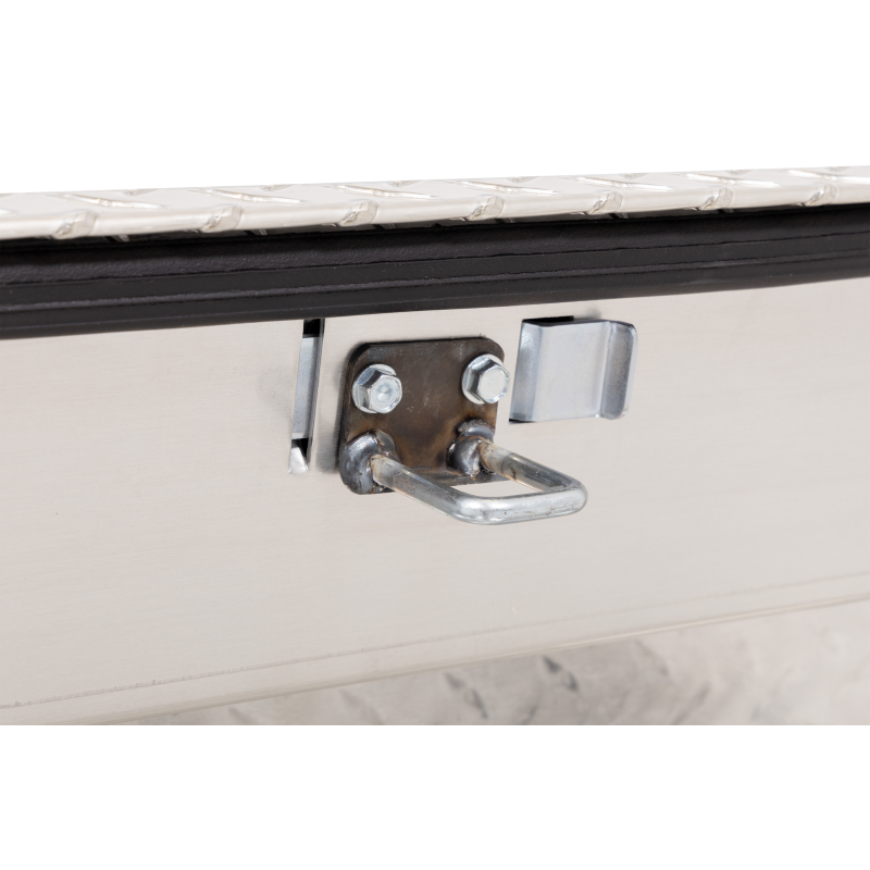 Close-up of the stainless under-rail mounting bracket and clamp and the black weather seal on the Weather Guard 164-0-04 Lo-Side box