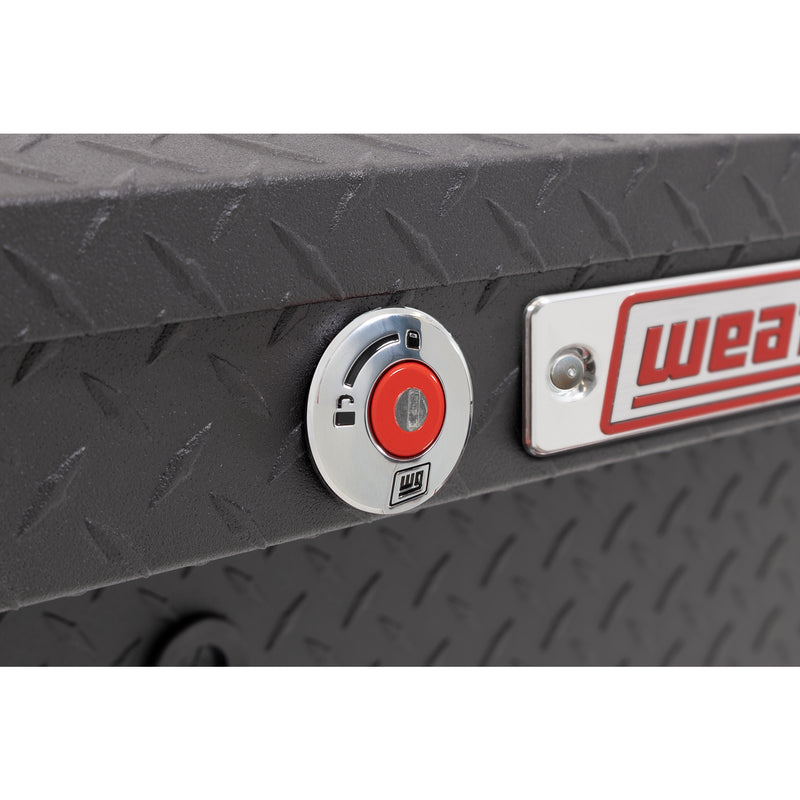 Weather Guard 164-52-04 Lo-Side box in textured matte black, close-up of the red push-button lock and Weather Guard badge
