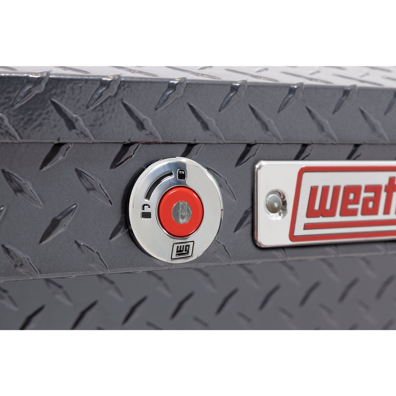 Weather Guard 164-6-04 Lo-Side box in gunmetal gray, close-up of the red push-button lock and Weather Guard badge