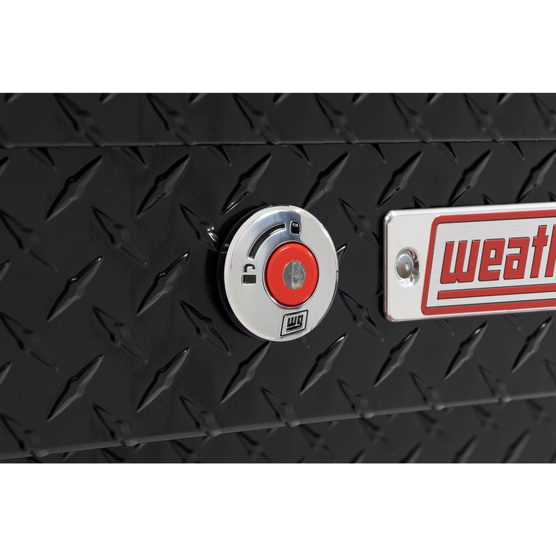 Weather Guard 174-5-04 Lo-Side box in gloss black, close-up of the red push-button lock and Weather Guard badge