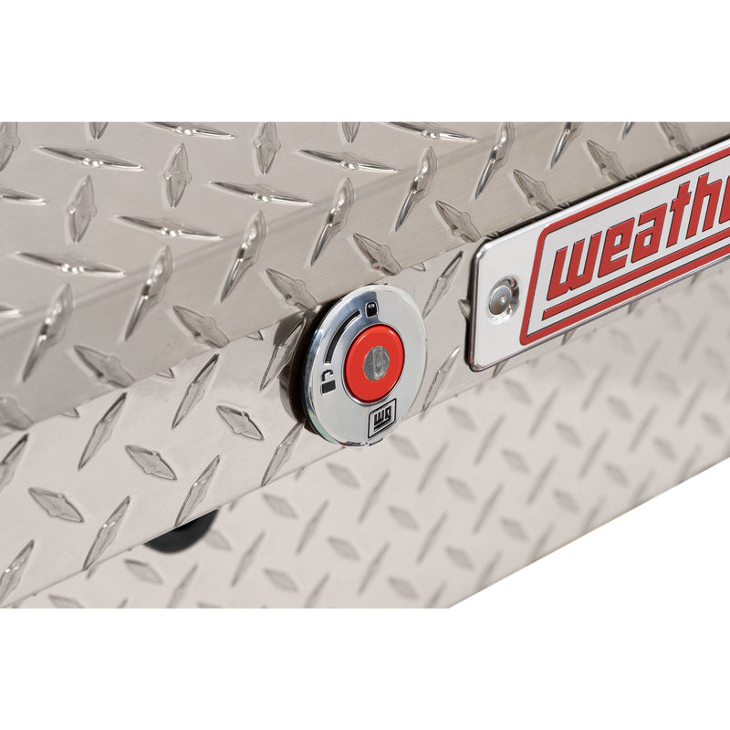 Weather Guard 178-0-04 low-profile Lo-Side box in bright aluminum diamond plate, close-up of the red push-button lock and Weather Guard badge