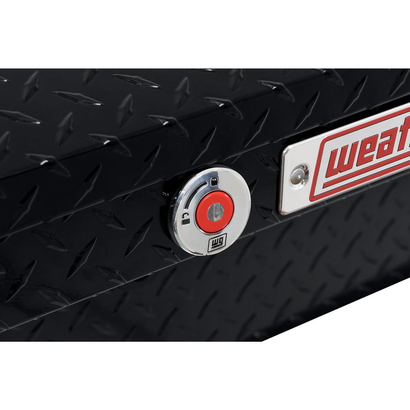 Weather Guard 178-5-04 low-profile Lo-Side box in gloss black, close-up of the red push-button lock and Weather Guard badge