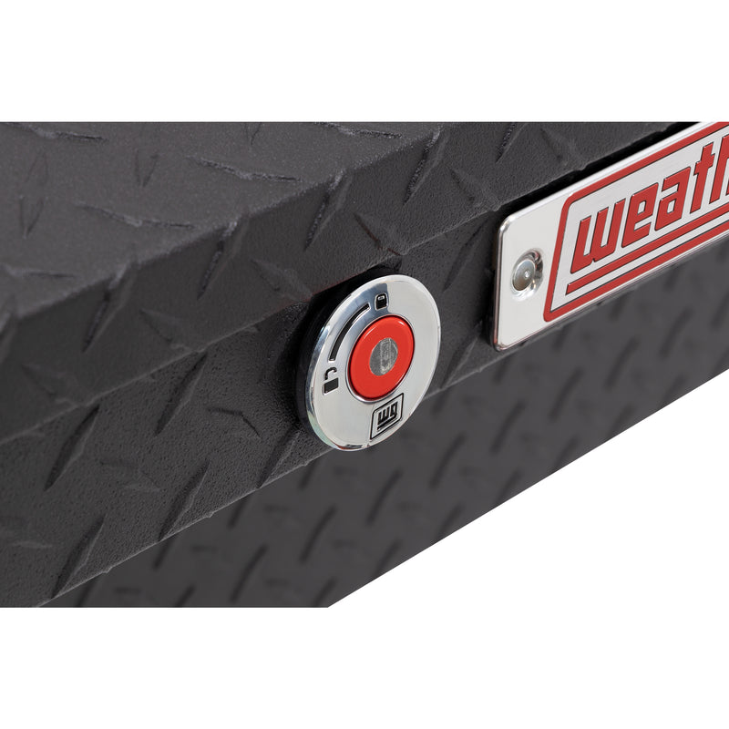 Weather Guard 178-52-04 low-profile Lo-Side box in textured matte black, close-up of the red push-button lock and Weather Guard badge