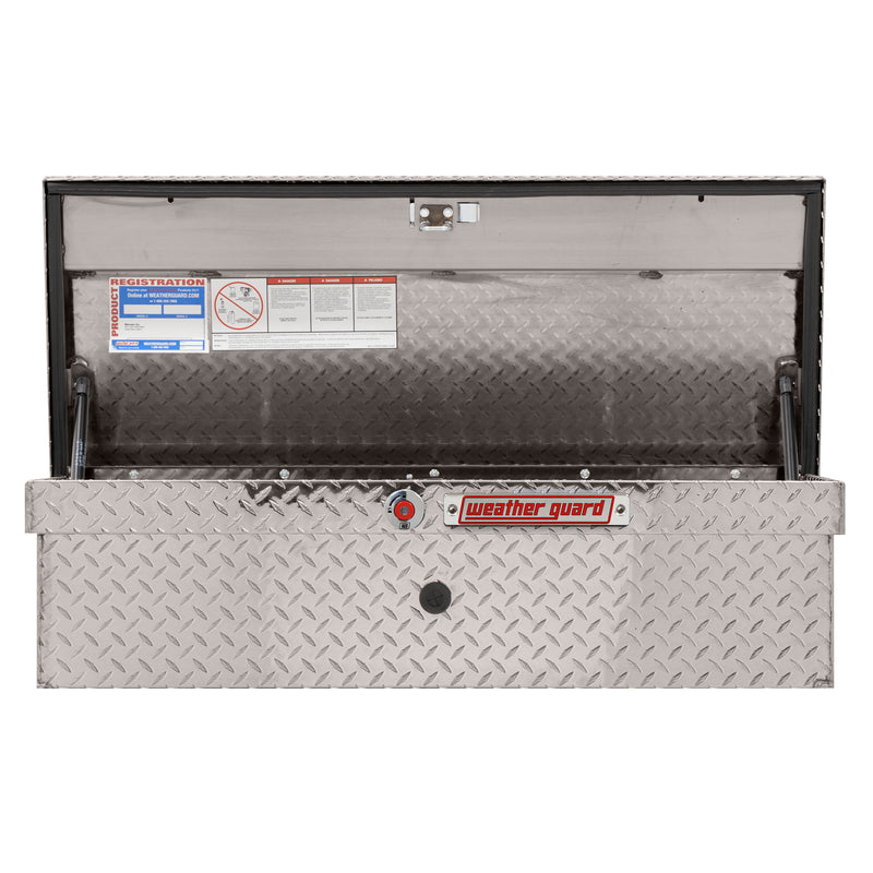 Weather Guard 180-0-04 low-profile Lo-Side box in bright aluminum diamond plate, straight-on front view with the lid open, showing the full interior