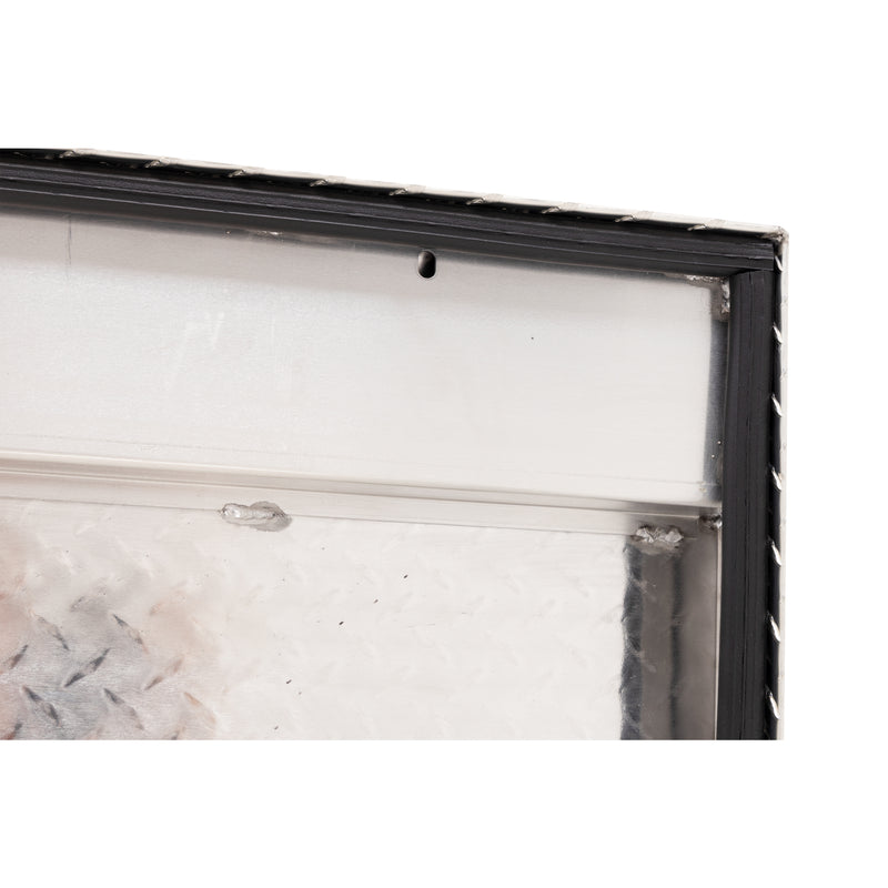 Weather Guard 180-0-04 low-profile Lo-Side box in bright aluminum diamond plate, close-up of the D-shaped ribbed weather seal around the opening