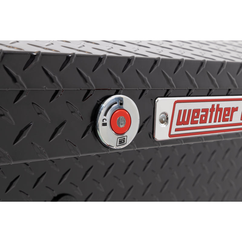 Weather Guard 180-5-04 low-profile Lo-Side box in gloss black, close-up of the red push-button lock and Weather Guard badge