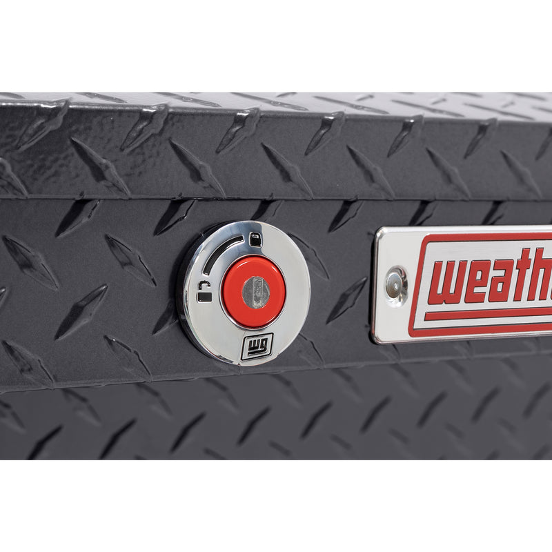 Weather Guard 180-6-04 low-profile Lo-Side box in gunmetal gray, close-up of the red push-button lock and Weather Guard badge