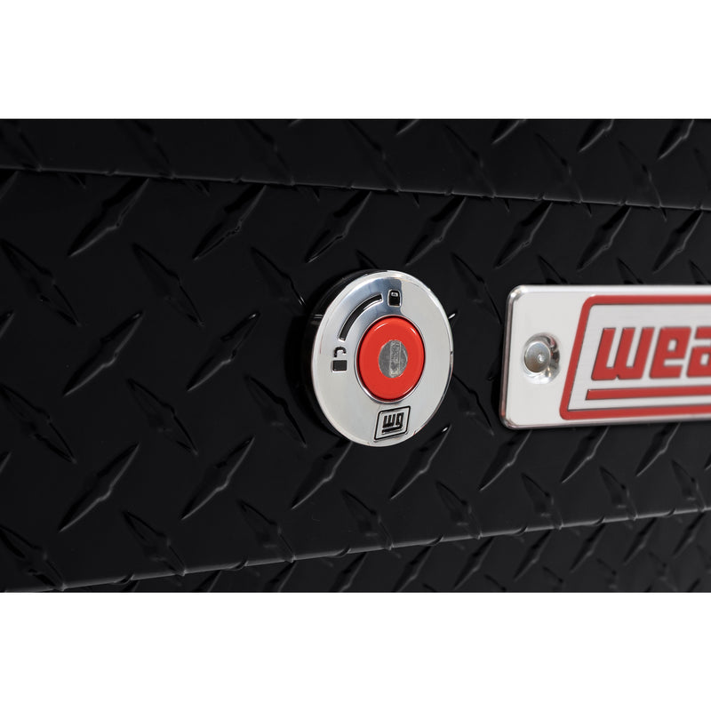 Weather Guard 184-5-04 Lo-Side box in gloss black, close-up of the red push-button lock and Weather Guard badge
