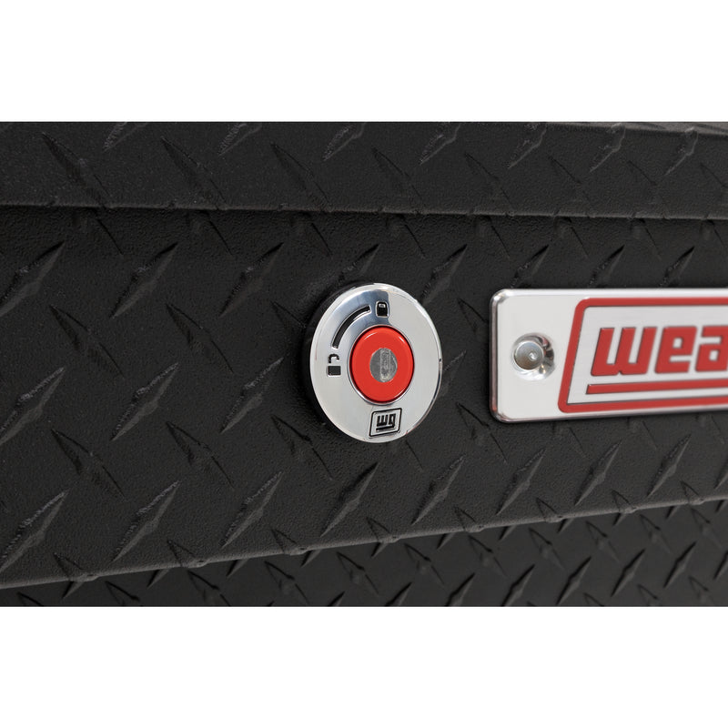 Weather Guard 184-52-04 Lo-Side box in textured matte black, close-up of the red push-button lock and Weather Guard badge