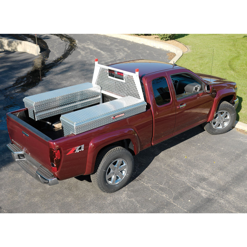 Brite white Weather Guard Protect-A-Rail cab protector fitted to a dark red pickup carrying two aluminum toolboxes