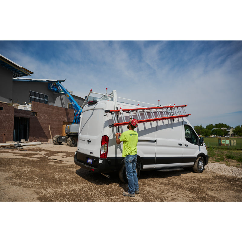 Weather Guard 2291-3-01 Extended EZGLIDE2 Drop-Down Van Ladder Rack, a technician lowering a ladder from the drop-down rack beside a white van on a jobsite