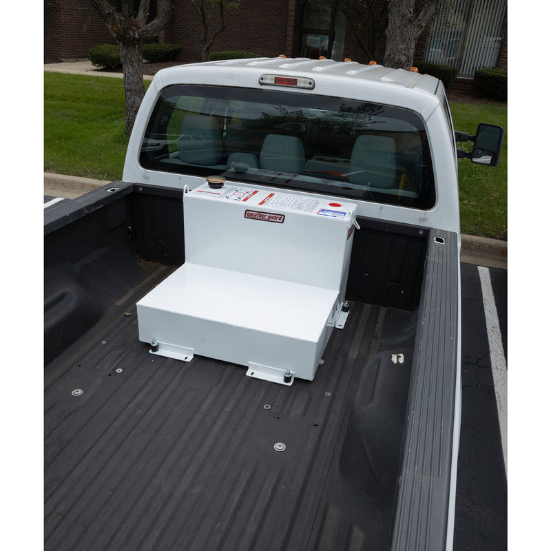 Wide view from the tailgate of the brite white 50 gallon Weather Guard tank mounted in a pickup bed