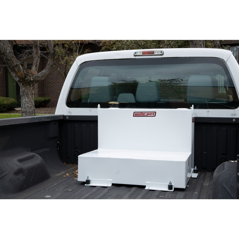 Brite white Weather Guard 50 gallon transfer tank bolted into the bed of a white pickup truck