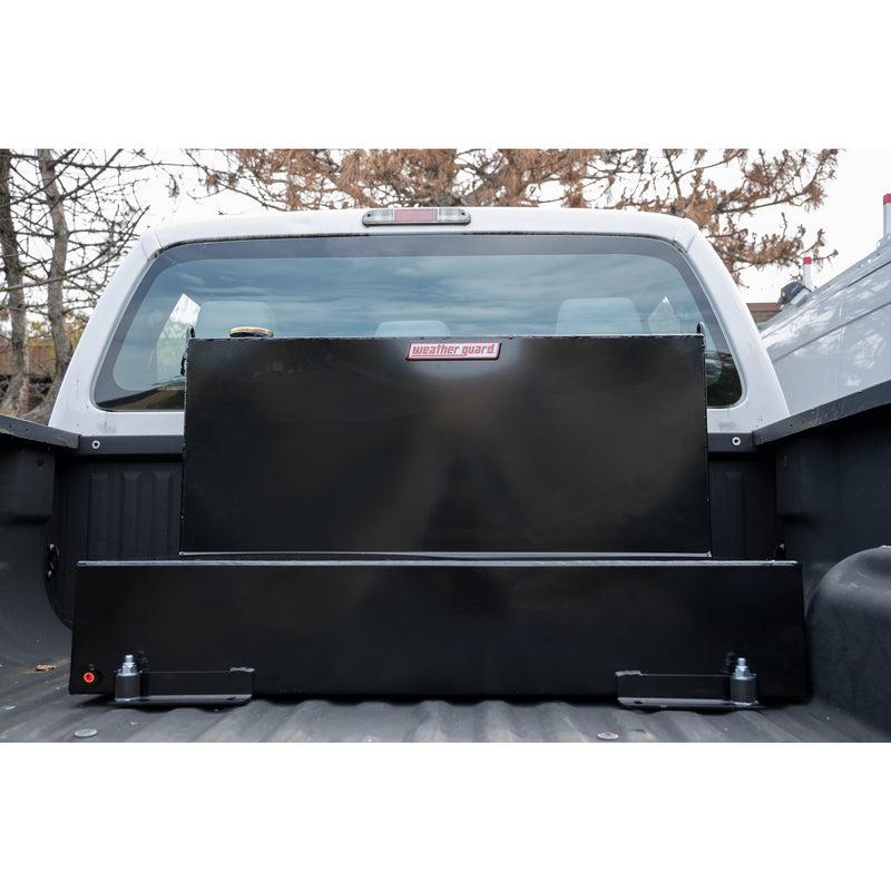 Gloss black Weather Guard 75 gallon transfer tank bolted into the bed of a white pickup truck