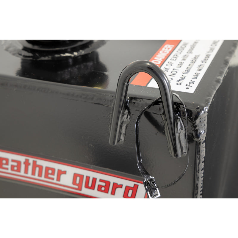 Detail of the welded steel lift handle and weather guard badge on a gloss black transfer tank