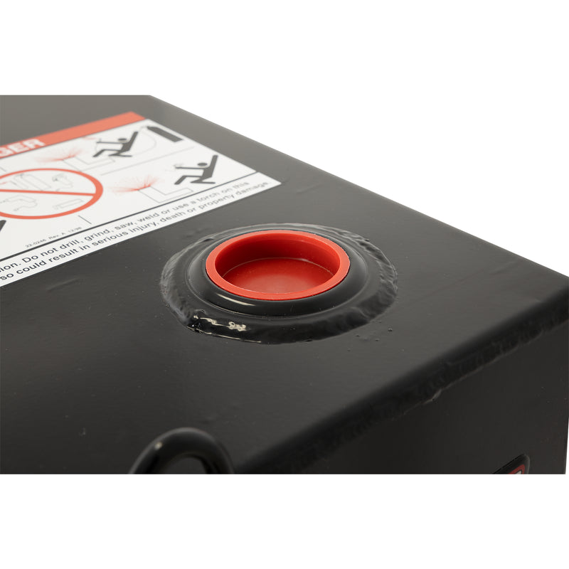 Detail of the 2 inch NPT pump bung with red plug on a gloss black Weather Guard transfer tank