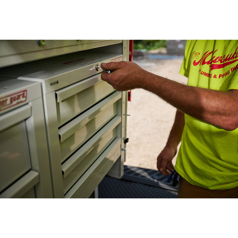 Weather Guard 903-3-01 Secure Storage 3-Drawer Module, a technician turning the key in the drawer module's lock