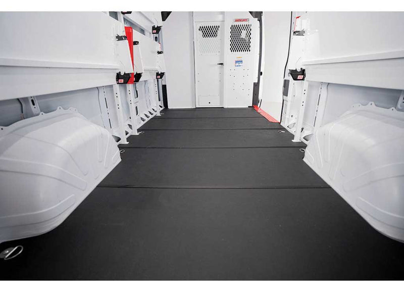 Weather Guard Rigid Van Flooring installed in a Ford Transit, interior view looking toward the rear doors over the flat non-slip floor