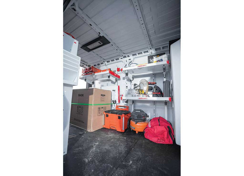 Weather Guard rigid floor in a Ford Transit, interior looking forward with cargo and tool cases on the flat surface