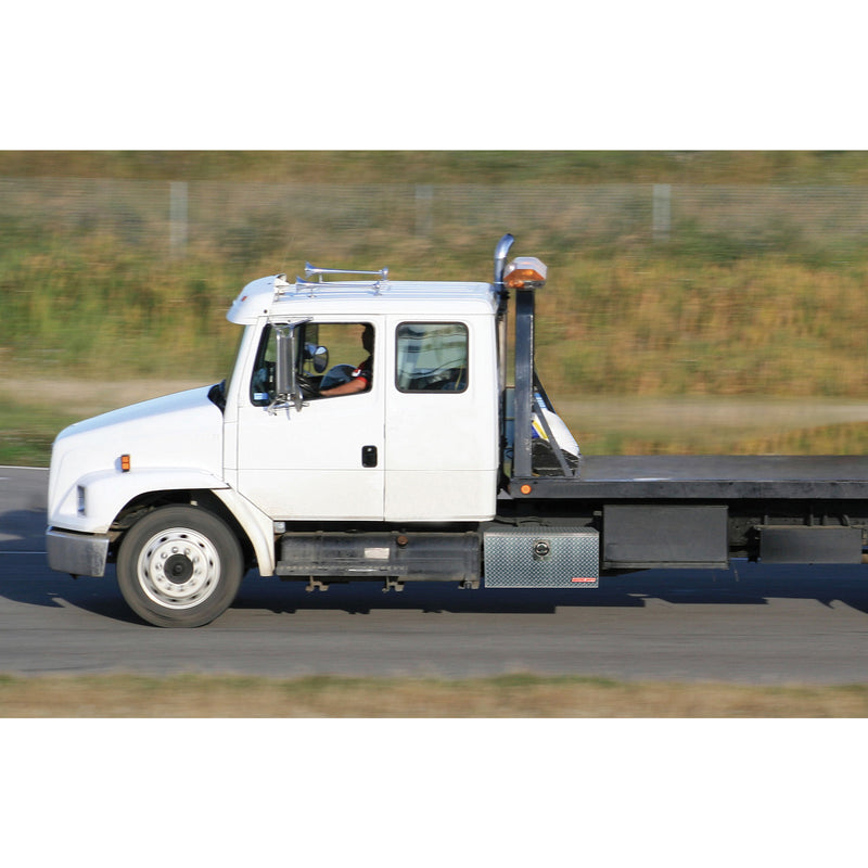 Weather Guard aluminum underbed tool box mounted under a flatbed truck body