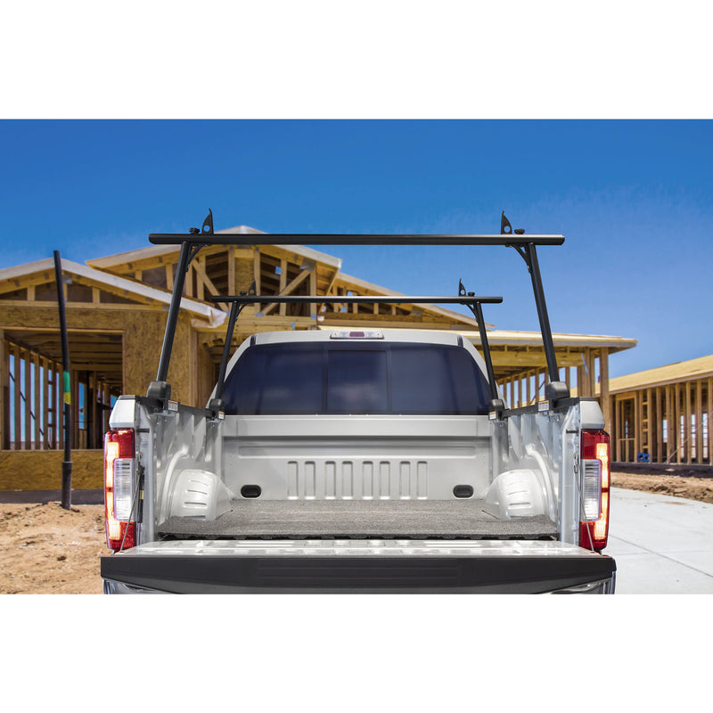 Weather Guard DEFENDER aluminum truck rack fitted to a silver pickup parked at a house framing site