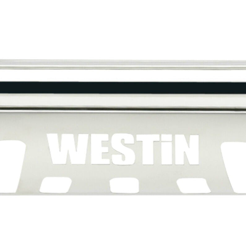 Close-up detail of the polished stainless steel skid plate on the Westin E-Series bull bar showing the laser cut Westin lettering and vent slots