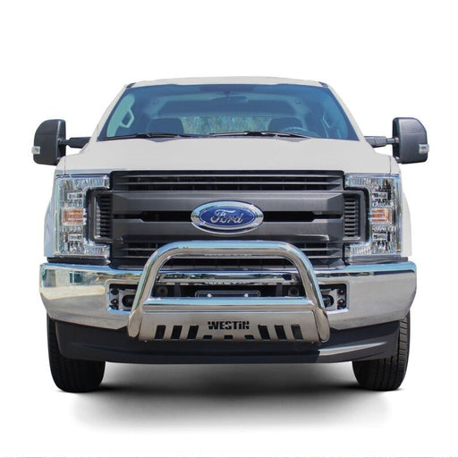 Westin E-Series 3 inch bull bar in polished stainless steel with a skid plate mounted on the front bumper of a white Ford Super Duty pickup truck against a white background