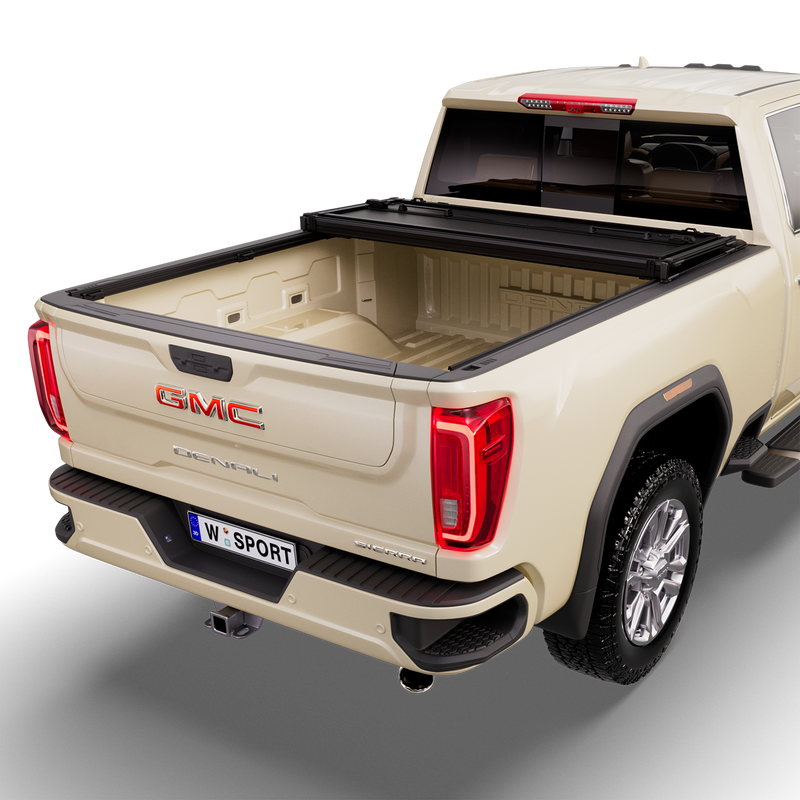 Worksport NEXUS hard folding tonneau cover on a pickup: studio render of a tan GMC Sierra Denali from the rear quarter with a black NEXUS hard folding tonneau cover with the cover folded twice and stacked at the cab