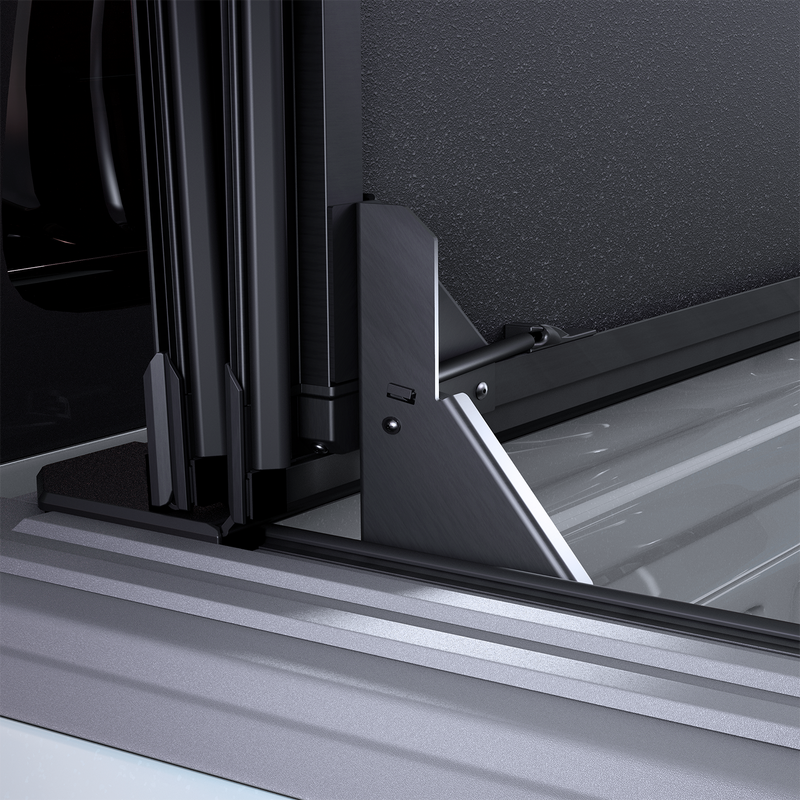 Close-up of the Worksport NEXUS hard folding tonneau cover: close-up render of the NEXUS flip-up arm holding the folded panel stack upright at the front of the bed