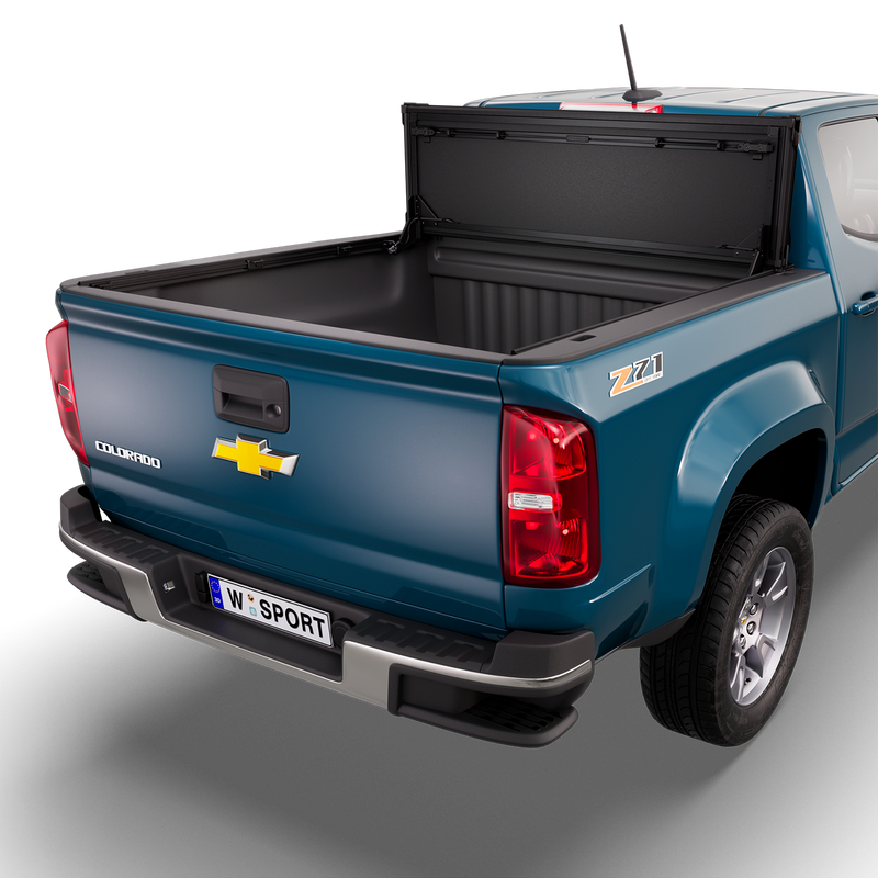 Worksport NEXUS hard folding tonneau cover shown on a 2015-22 Chevrolet Colorado, an older generation than the trucks this listing fits: studio render with the cover folded and flipped up against the cab, full bed open