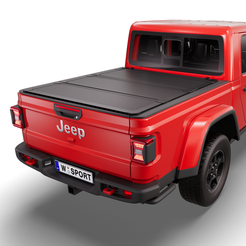 Worksport NEXUS hard folding tonneau cover on a pickup: 3D studio render of a red Jeep Gladiator from the rear quarter with a black NEXUS hard folding tonneau cover closed, all three panels flat over the bed
