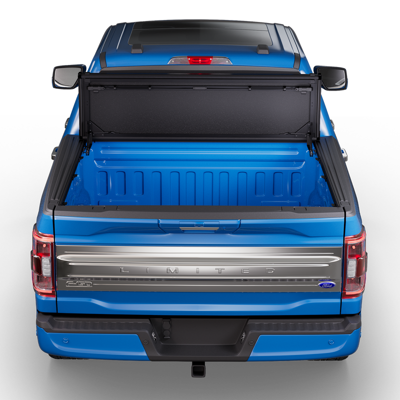 Worksport NEXUS hard folding tonneau cover shown on a 2021+ Ford F-150, a newer generation than the trucks this listing fits: NEXUS cover flipped up on a blue F-150 Limited