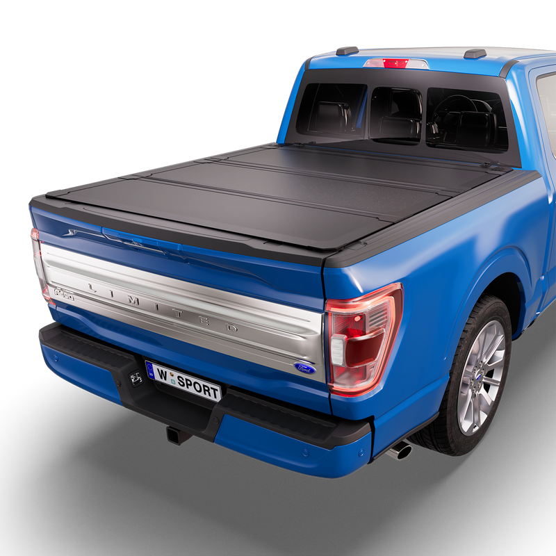 Worksport NEXUS hard folding tonneau cover shown on a 2021-23 Ford F-150, a newer generation than the trucks this listing fits: studio render with the cover closed, all three panels flat over the bed
